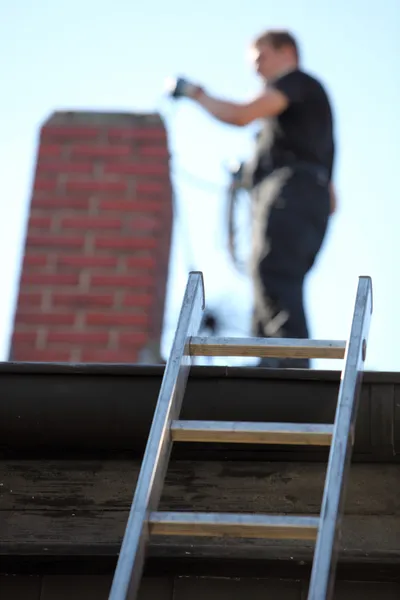 Technician at work - J R A Chimney & Ducts Solutions, Glendale